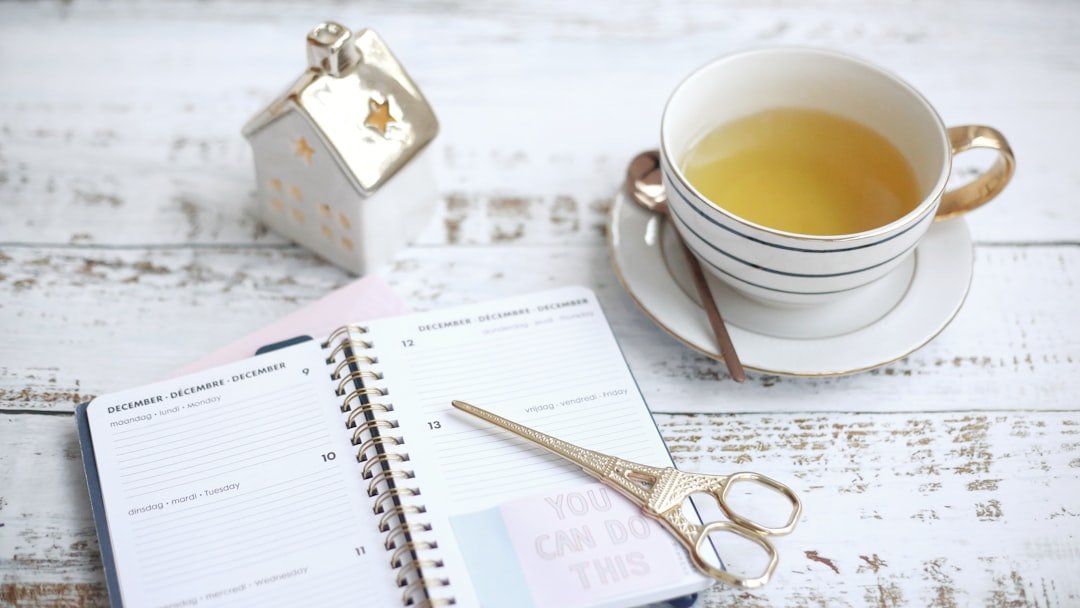a cup of tea and some scissors